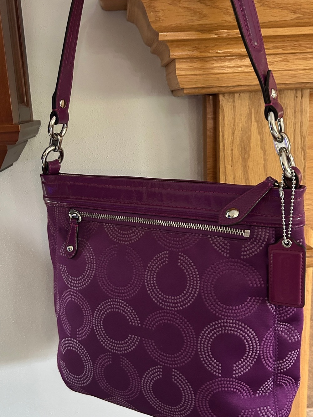 Coach Magenta Signature Circle Crossbody Bag.